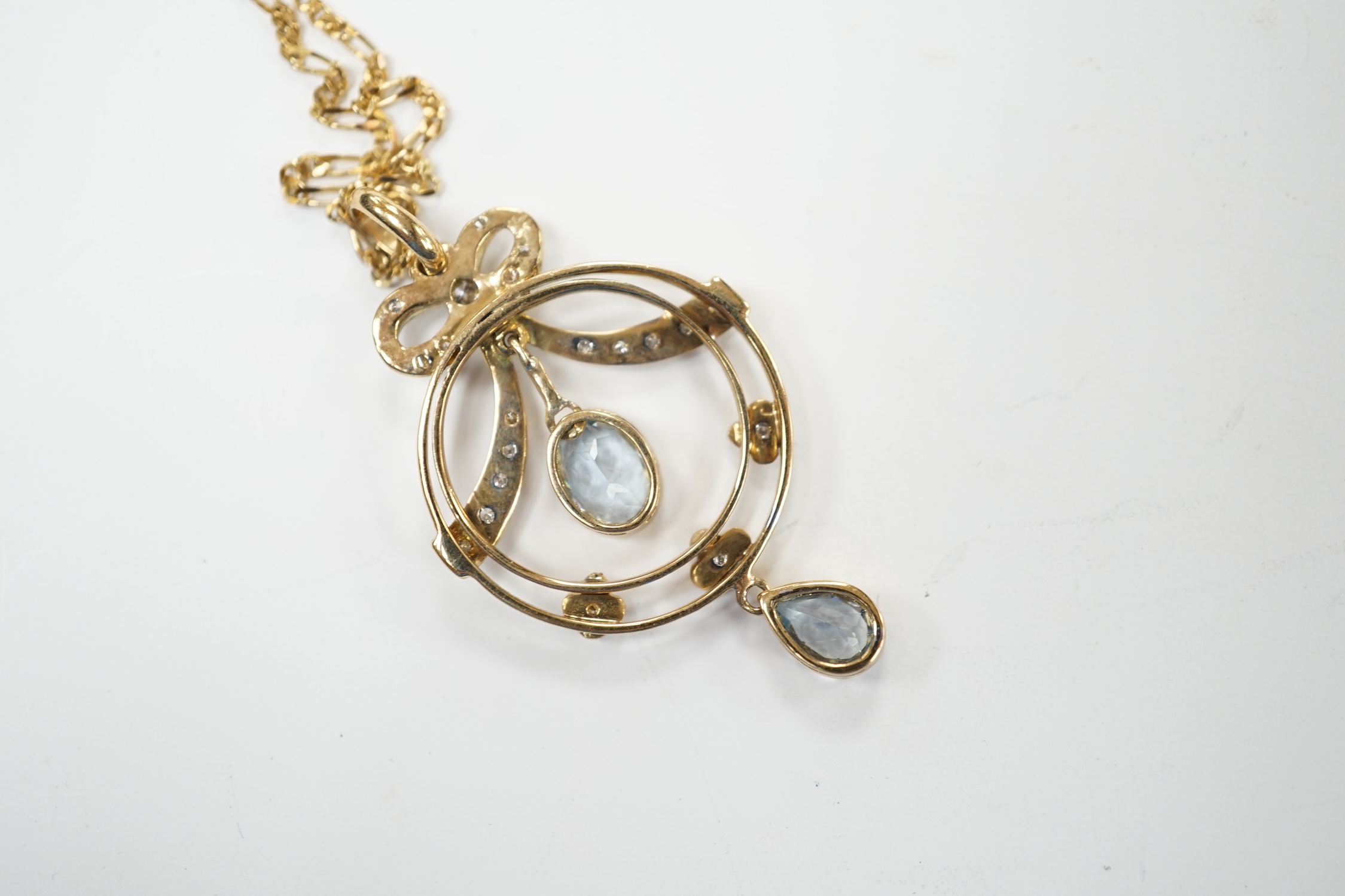 A modern 9ct gold, aquamarine and diamond cluster set drop pendant necklace, pendant 40mm, chain, 44cm, gross weight 5.2 grams. Good condition.